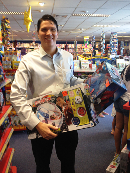 Marriott Care Foundation President Ben Figarao picking out the toys at Top 1 Toys.JPG