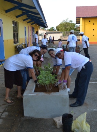 Placing new flower pots at Fatima College.JPG