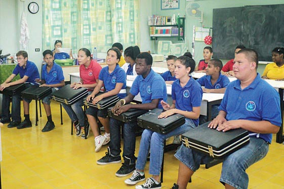 Tasmania band practices on their instuments.jpg