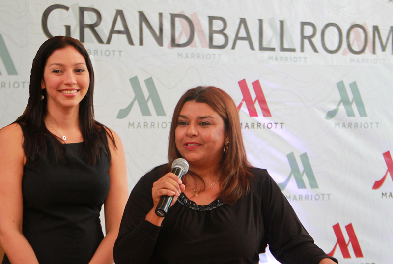 Sen. Sales Mng Chela and Sales Coordinator Abigail welcome their clients and press to the re-opening of the Grand Ballroom.JPG