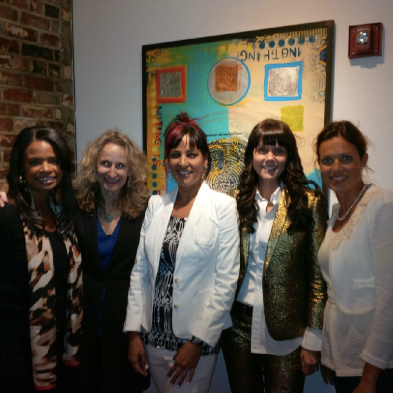 Elisa Lejuez flanked by gallery owners and news anchor.jpeg