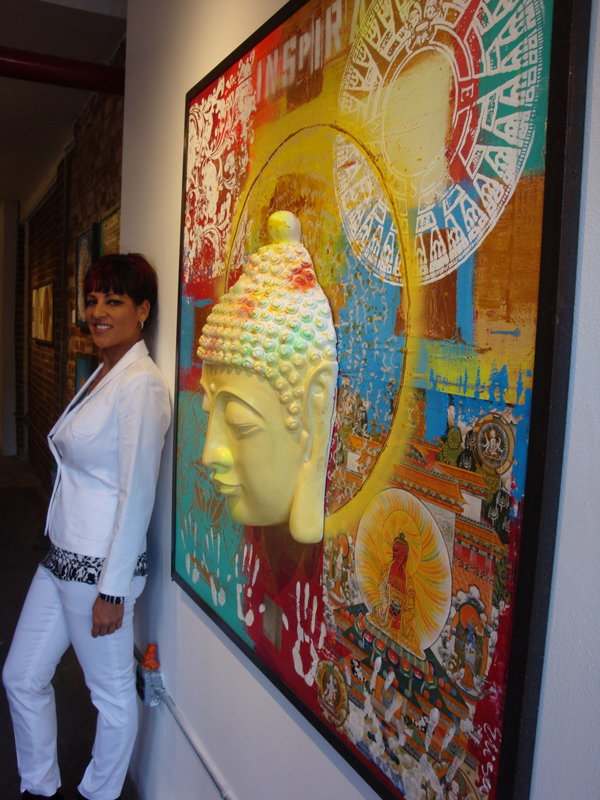 Elisa Lejuez posing next to her artwork 3-D Buddha.jpeg