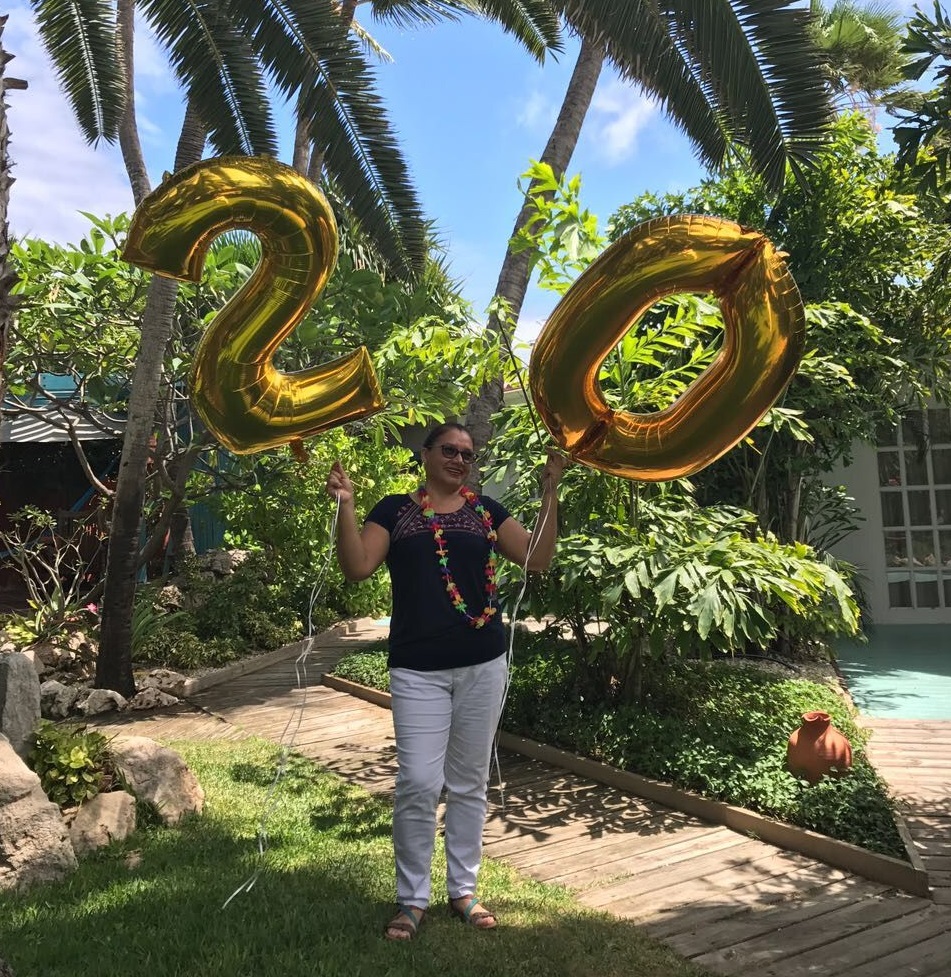 Veronica celebrating 20 years at Boardwalk in tropical hotel garden.jpg