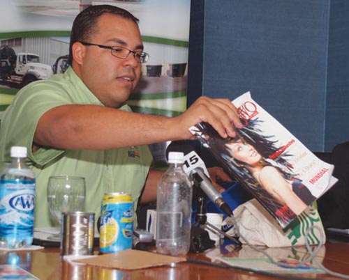 chaim dispalys various items accepted for recycling.jpg